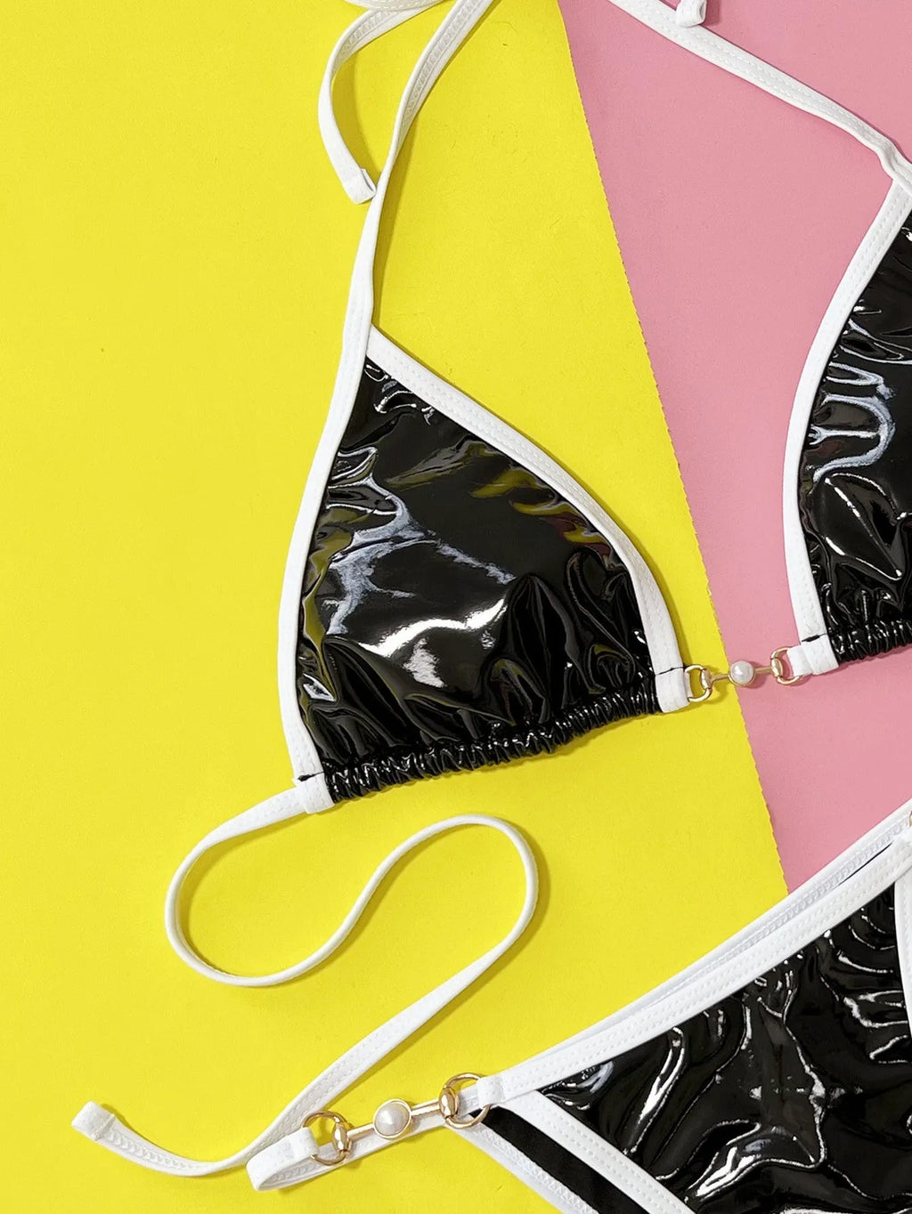 Black women's two-piece split bikini swimsuit set on a white background.