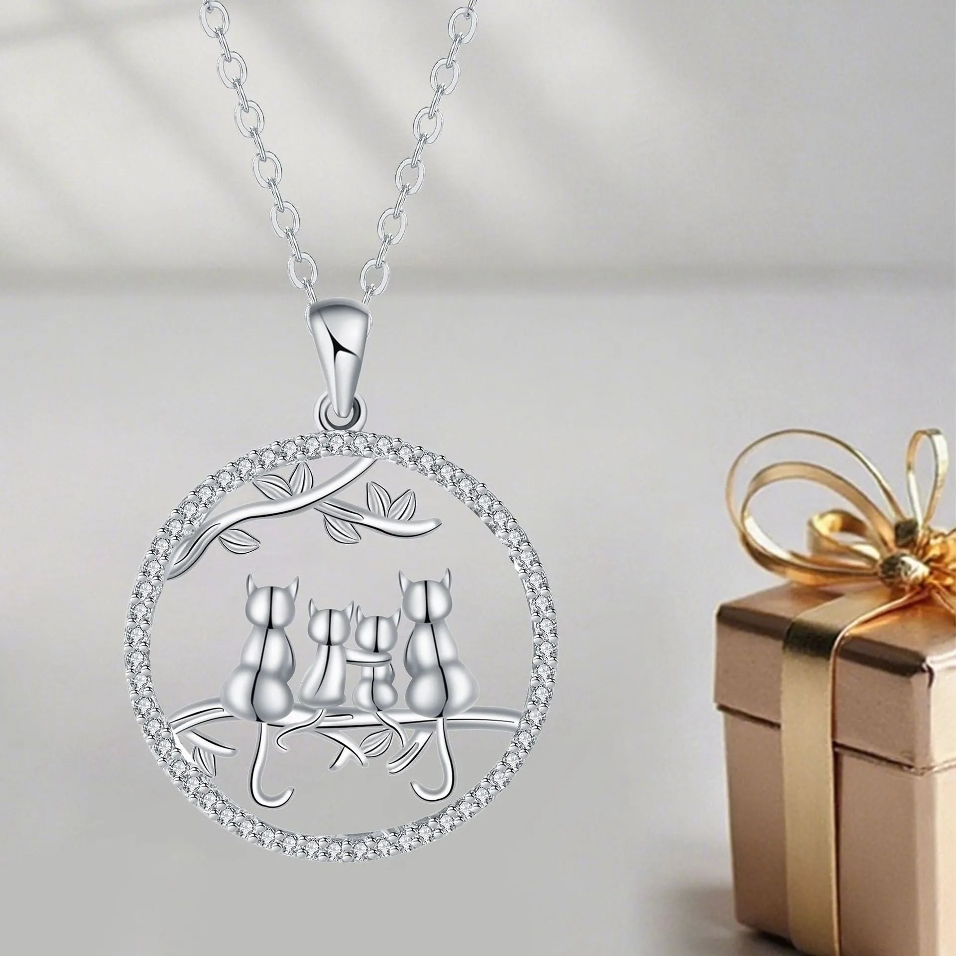 Four Kitten Necklace with cat motif pendant on cross chain