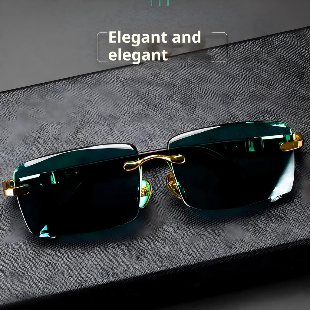 Frameless sunglasses with dark green lenses displayed alongside a protective hard case and cleaning cloth.