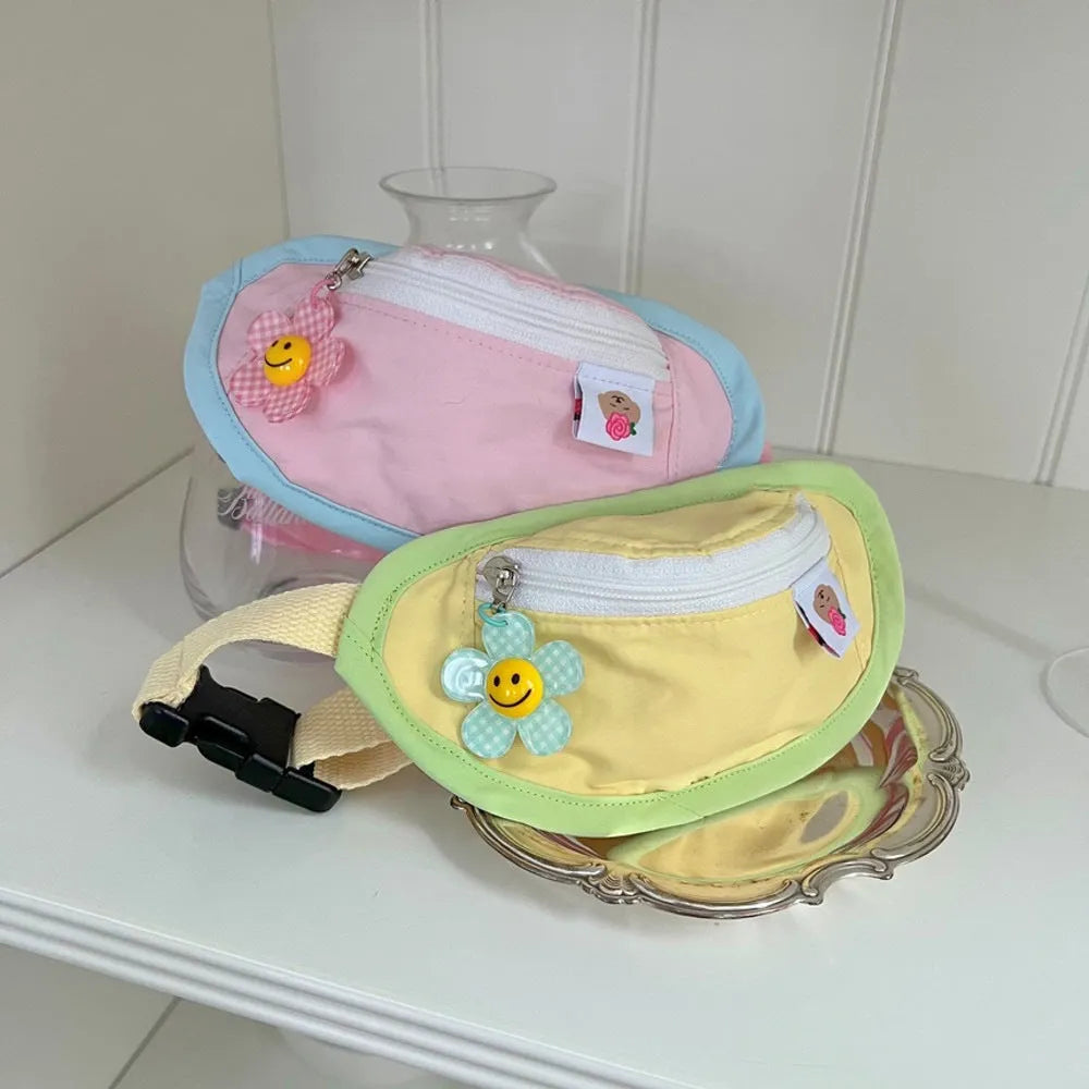 Powder blue backpack-style poop bag dispenser attached to a dog harness.