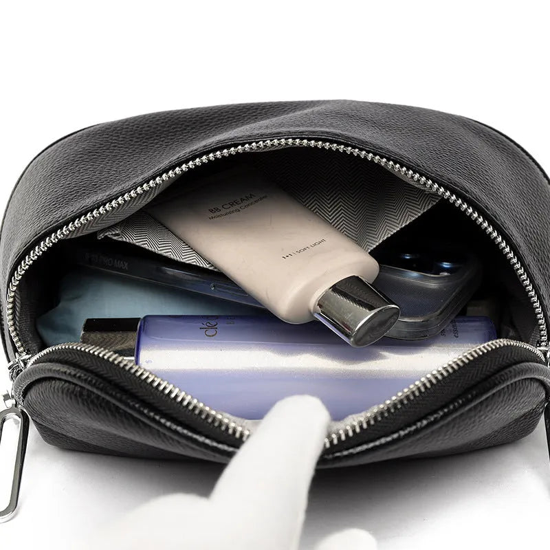 A soft black PU leather women's messenger bag with a saddle shape and cross-body strap on a white background.