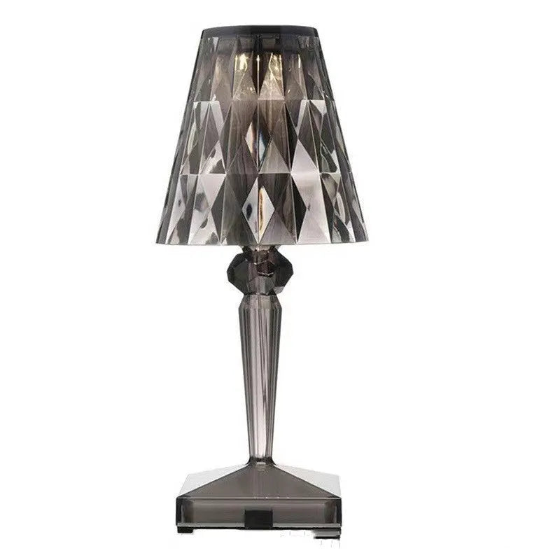 Rose gold plated portable touch control night light on a surface, showing its cubic base and height.