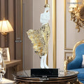 A tall, modern sculptured character ornament in a rose gold metallic finish, standing 48cm high.