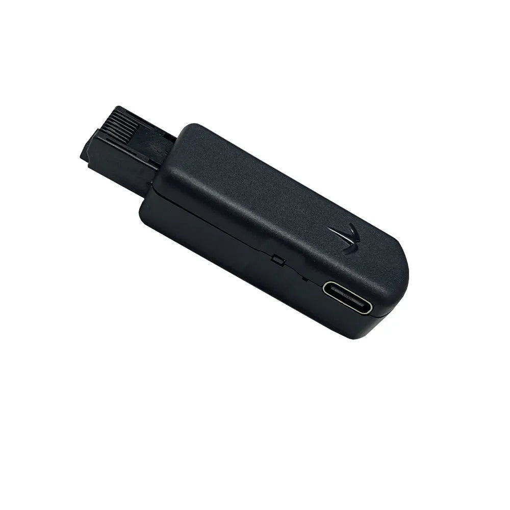 Black aluminum alloy JB Tool USB adapter for console firmware switching with Ethernet port.