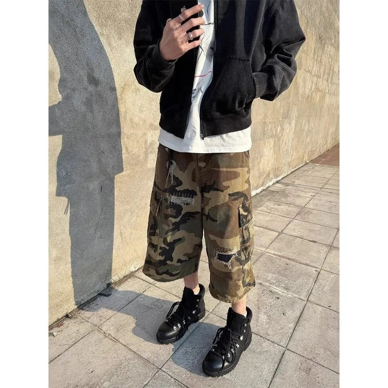 Men's camouflage cropped jeans with retro patches and ripped detailing on straight leg trousers