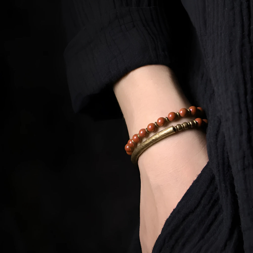 Layered ethnic bracelet with natural stone beads and brass fittings in adjustable sizing