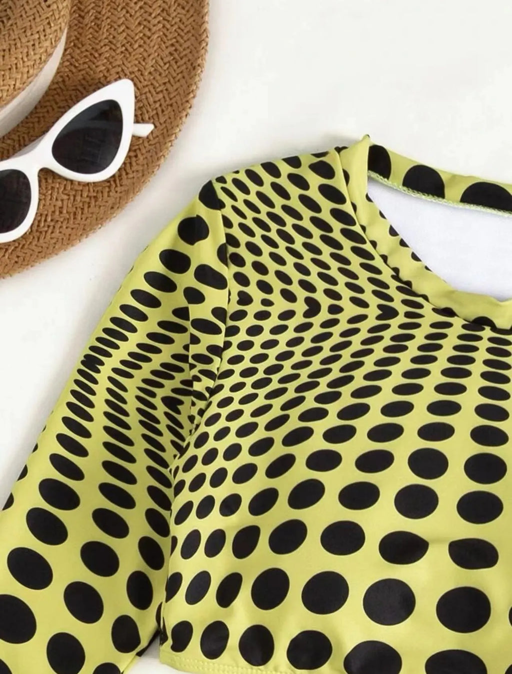 Green polka dot women's three-piece swimsuit set showing bikini top, skirt, and bra.
