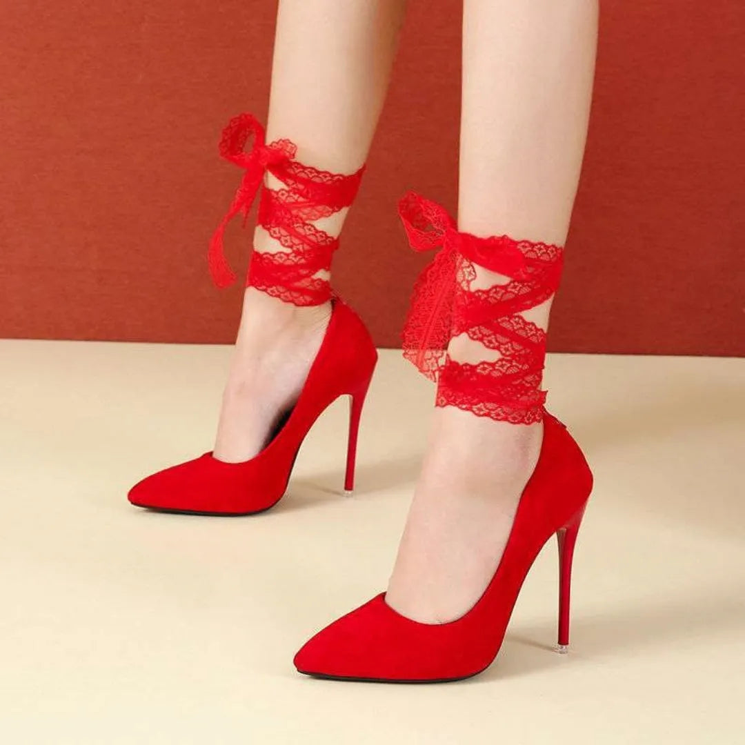 Women's black stiletto heels with thin ankle strap and pointed toe design
