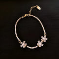 Women's gold colour copper bracelet with geometric zircon inlays and quadrilateral design