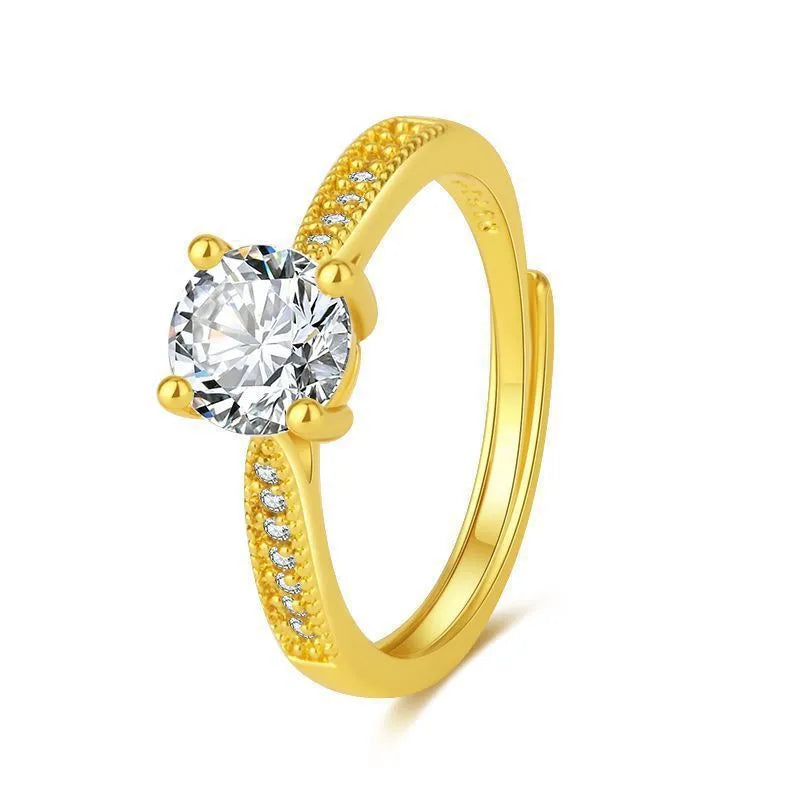 Classic four-claw ring with 1 karat eight hearts eight arrows zircon in gold colour on white background