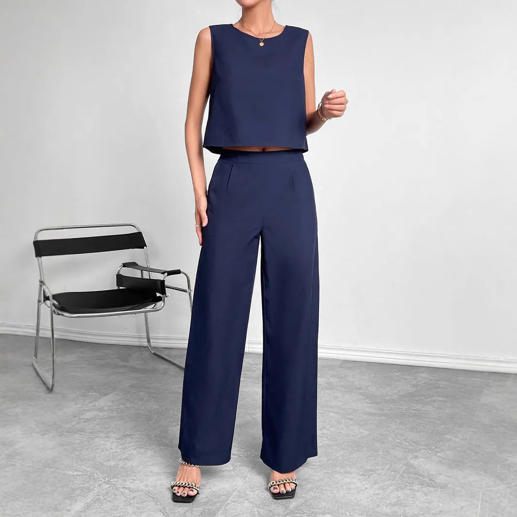 Red sleeveless round neck top with matching wide leg trousers two-piece set