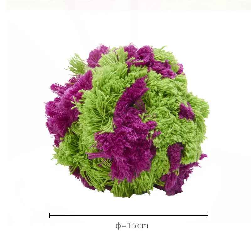 Purple seaweed-scented plush dog chew ball with knot design for teething and interactive play