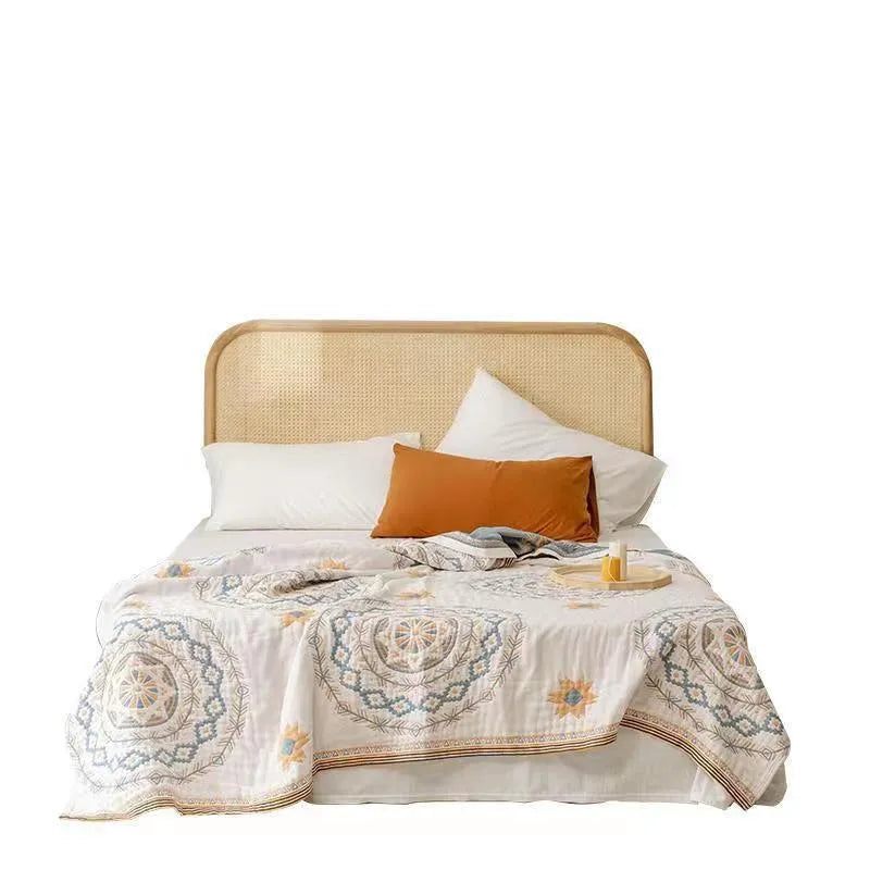 Cotton towel blanket with a modern geometric pattern, shown folded.