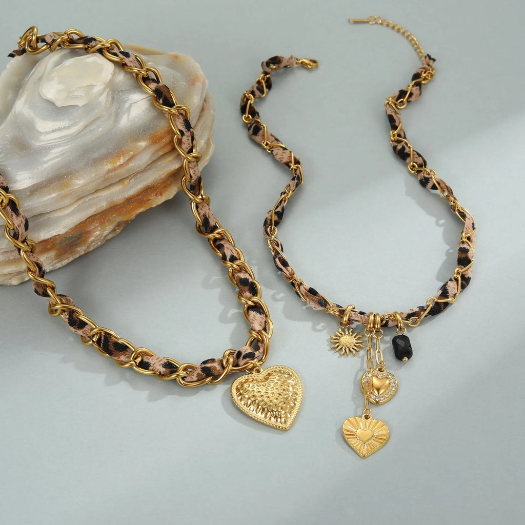 Stainless steel necklace with geometric leopard and heart pendant on adjustable chain