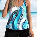 Blue tie-dye floral print women's swimsuit set, showing separate top and shorts.