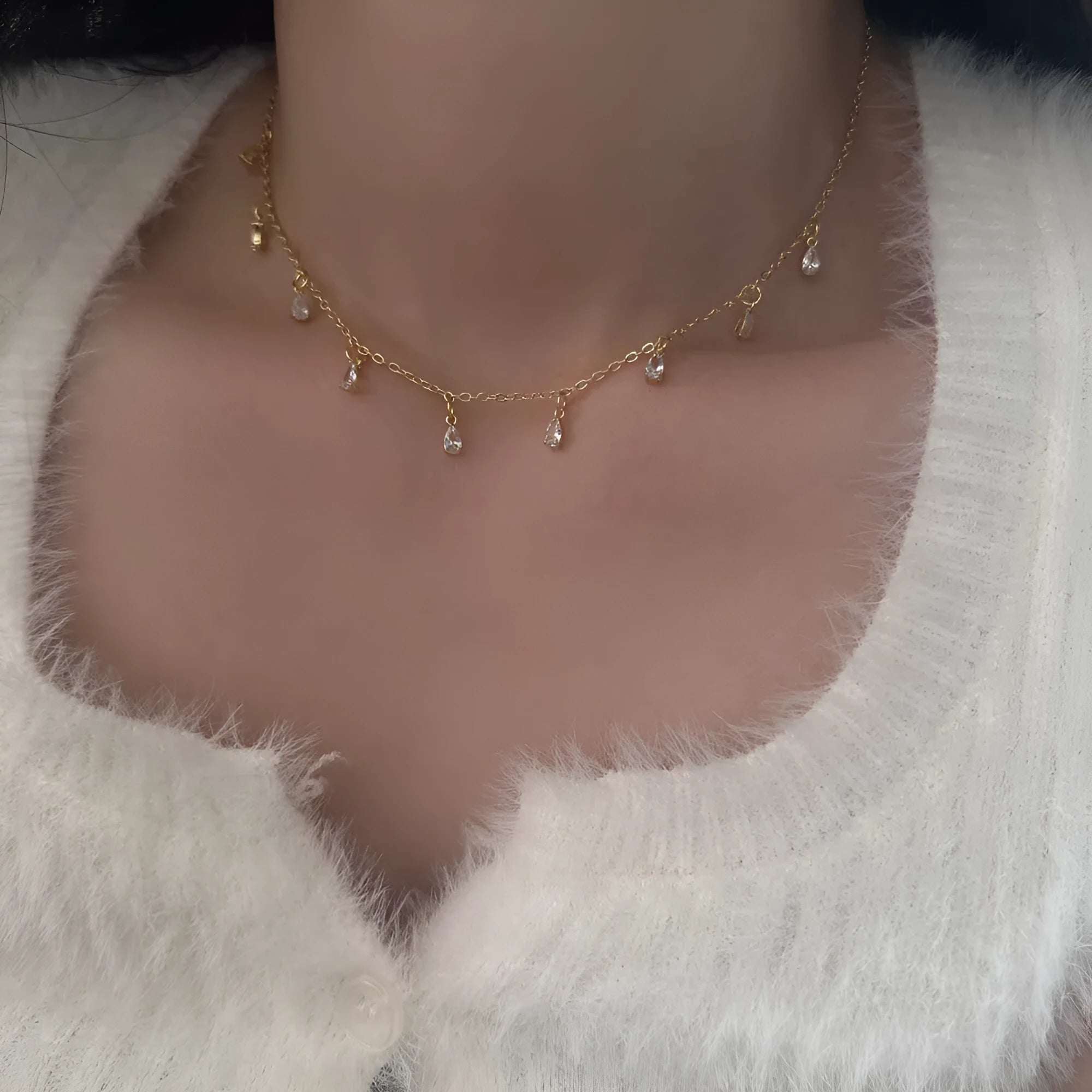 Women's zircon necklace, earrings, and anklet set with geometric pendant.