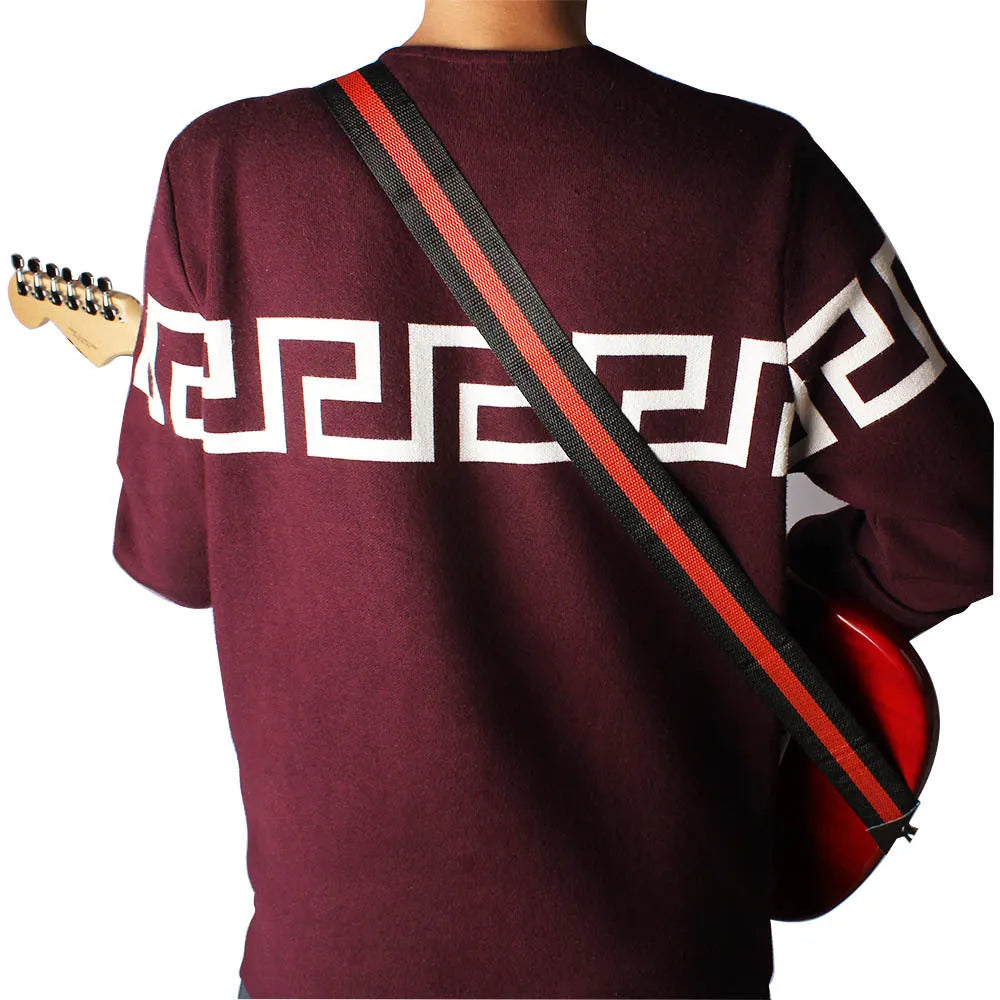 Woven crossbody guitar strap shown in one of five colours: Army Green, Dark Blue, Red, White, or Yellow.