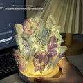 Butterfly shaped night lamp with glass shade and raw wood base on bedside table