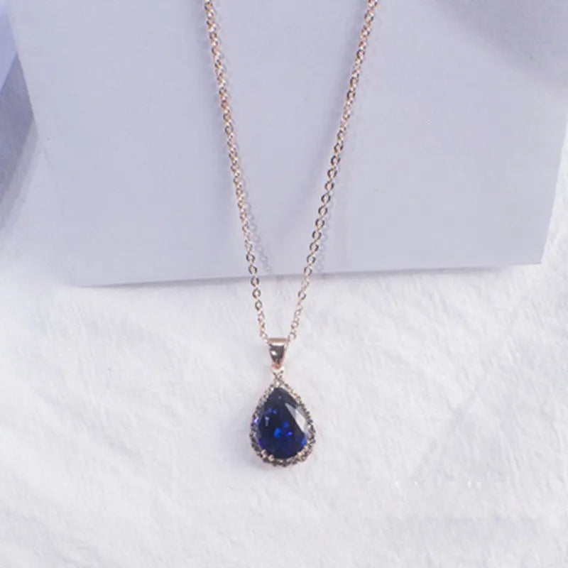 Women's alloy water drop necklace with rose gold electroplated colour and rhinestone inlays on a geometric pendant.