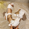 Plus size thick high heel sandal with buckle strap and rivet detailing in beige.