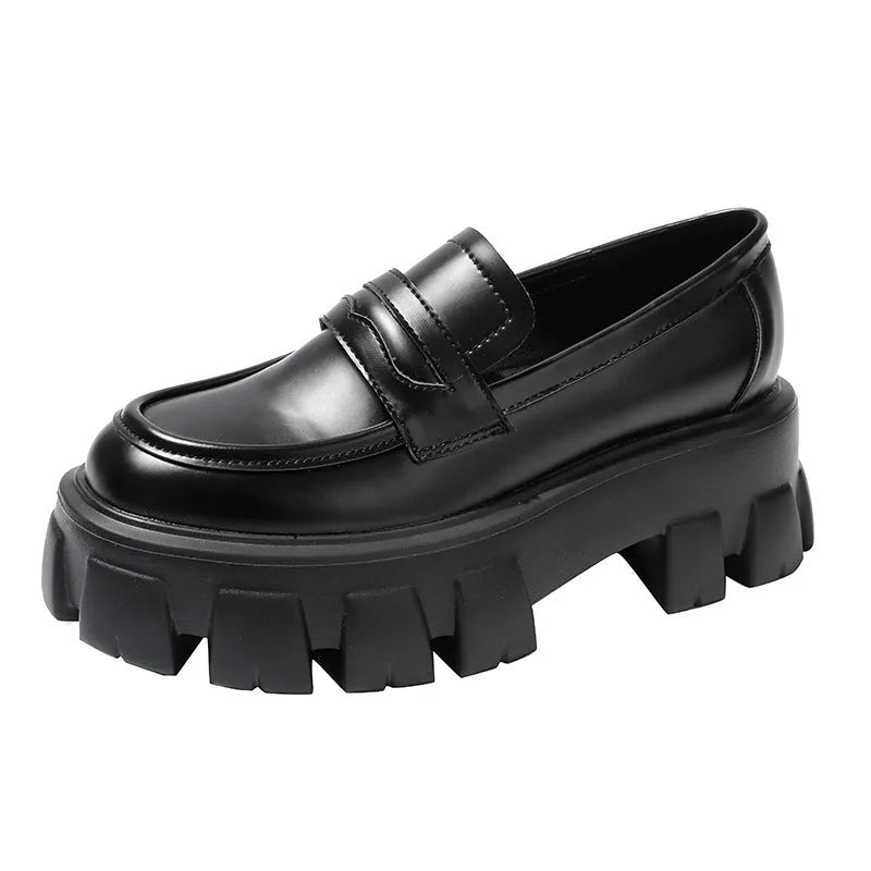 A pair of British style wide fit loafers with a muffin heel, shown in patent leather and matte colour options.