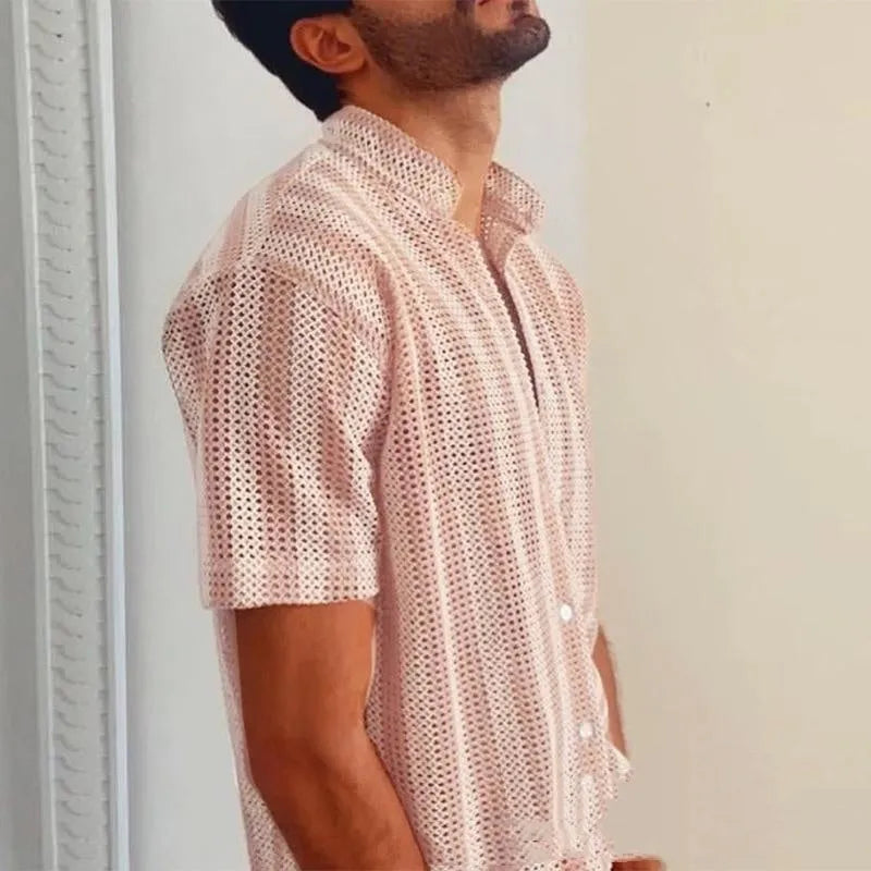 Pink men's short-sleeve cardigan shirt with a waffle-knit texture on a hanger.