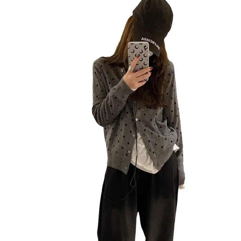 Women's grey dot knitted cardigan with crocheted flower detail and long sleeves