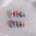 Handmade colourful false nails with embossed small flower and butterfly designs in almond shape.