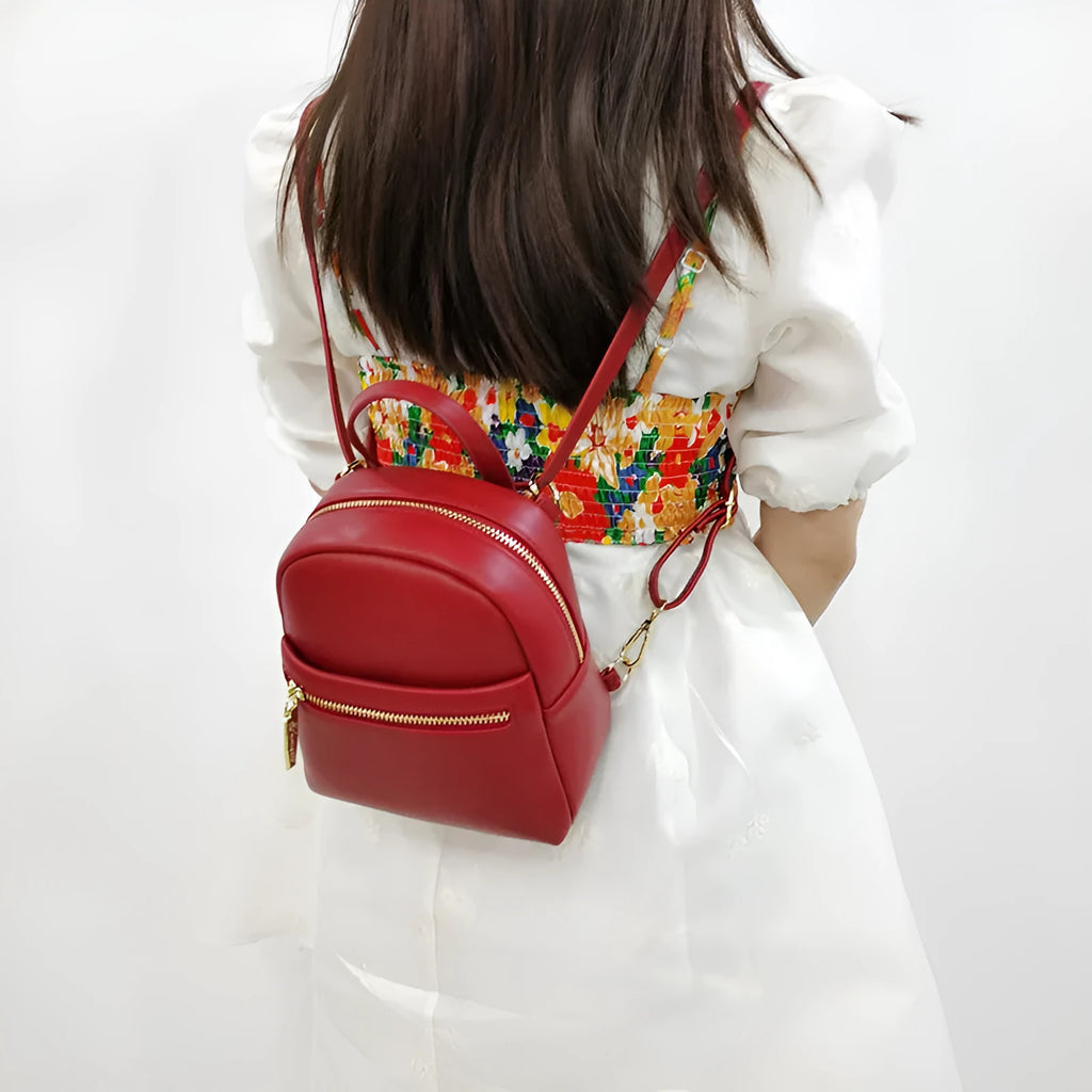 Soft PU leather mini backpack in street-trend style with contrast trim and large capacity.