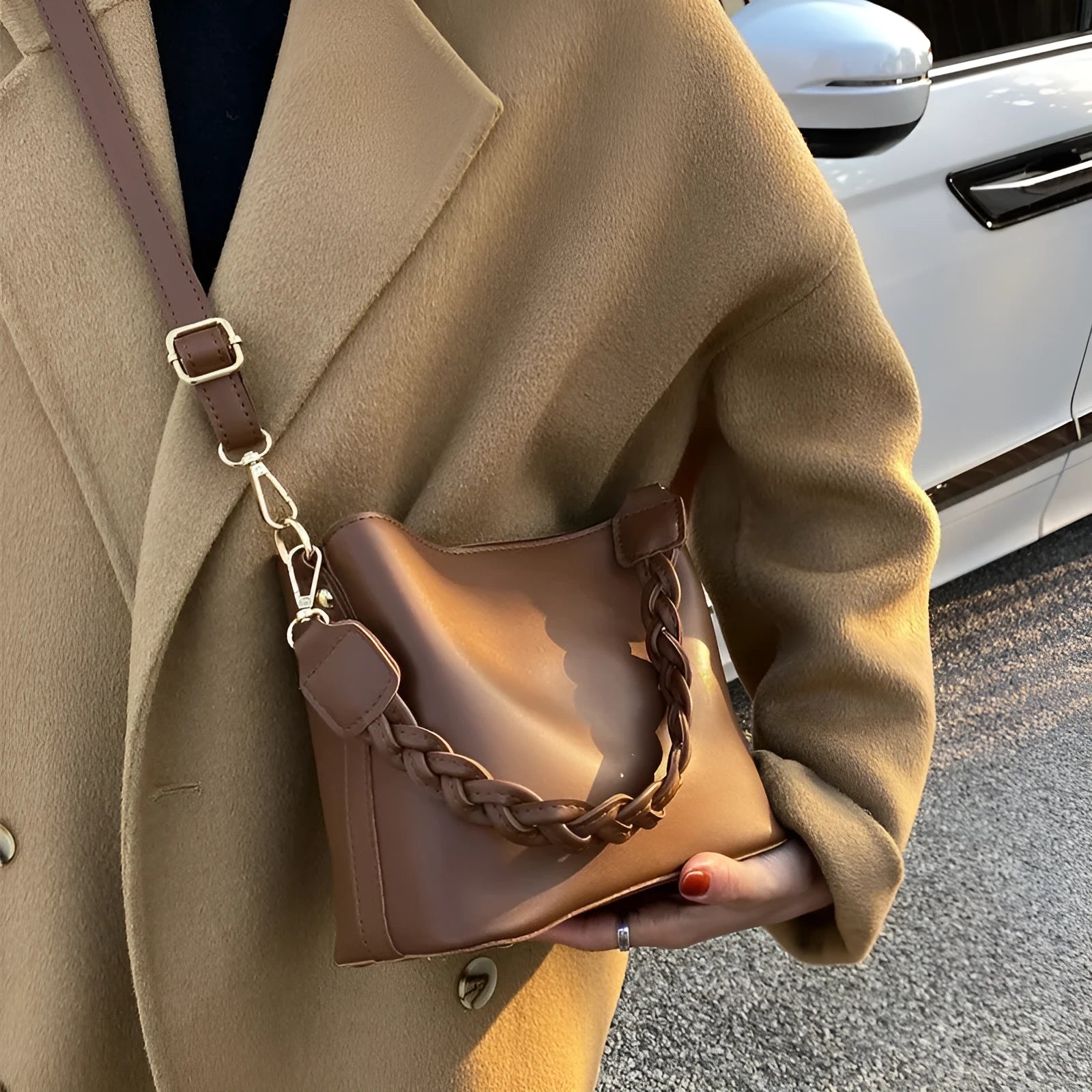 Retro woven PU bucket bag in khaki colour with crossbody strap shown in model shot