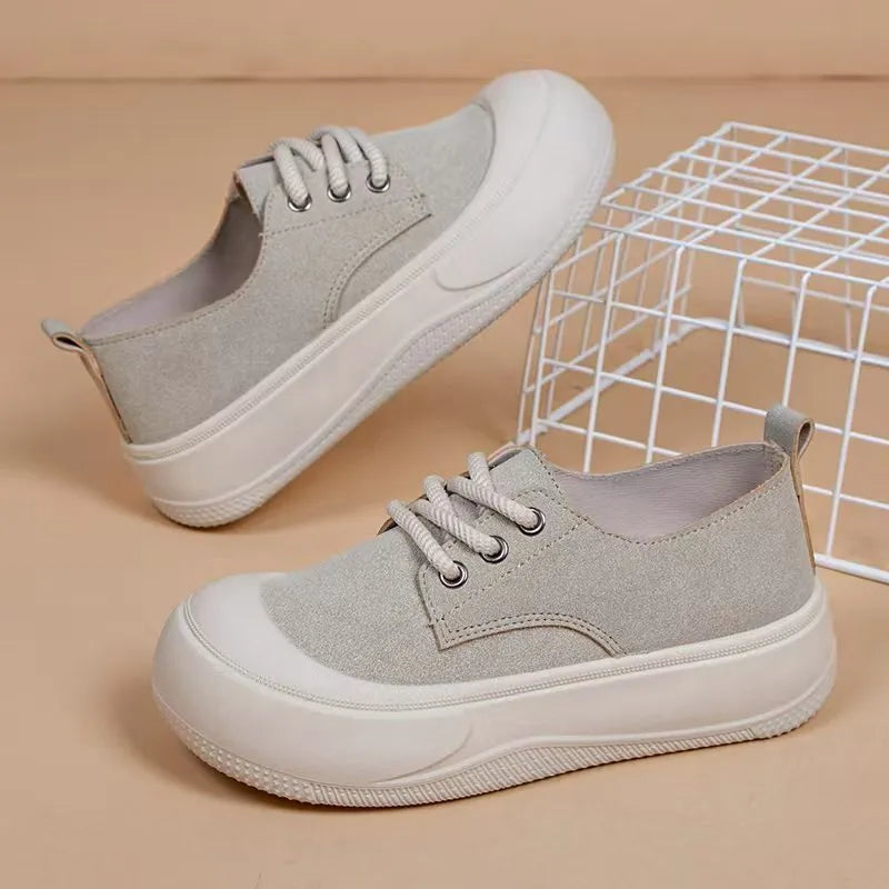 Women's beige suede platform loafers with lace-up front and round toe on a flat 4CM rubber sole.