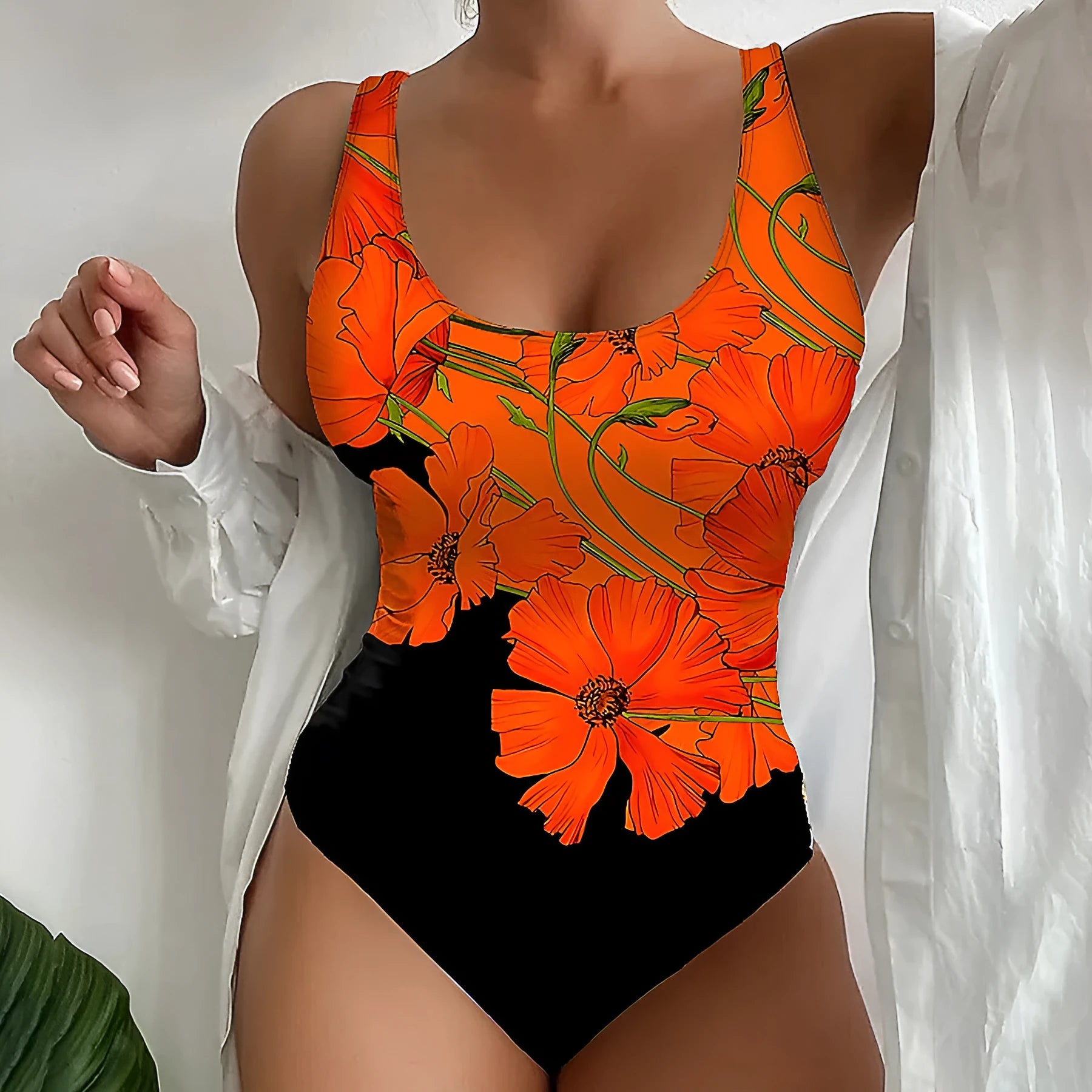 Orange flowers printed backless one-piece swimsuit with slim fit design on mannequin