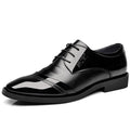 Men's casual Korean pointed leather shoes in black with stitching details and rubber sole