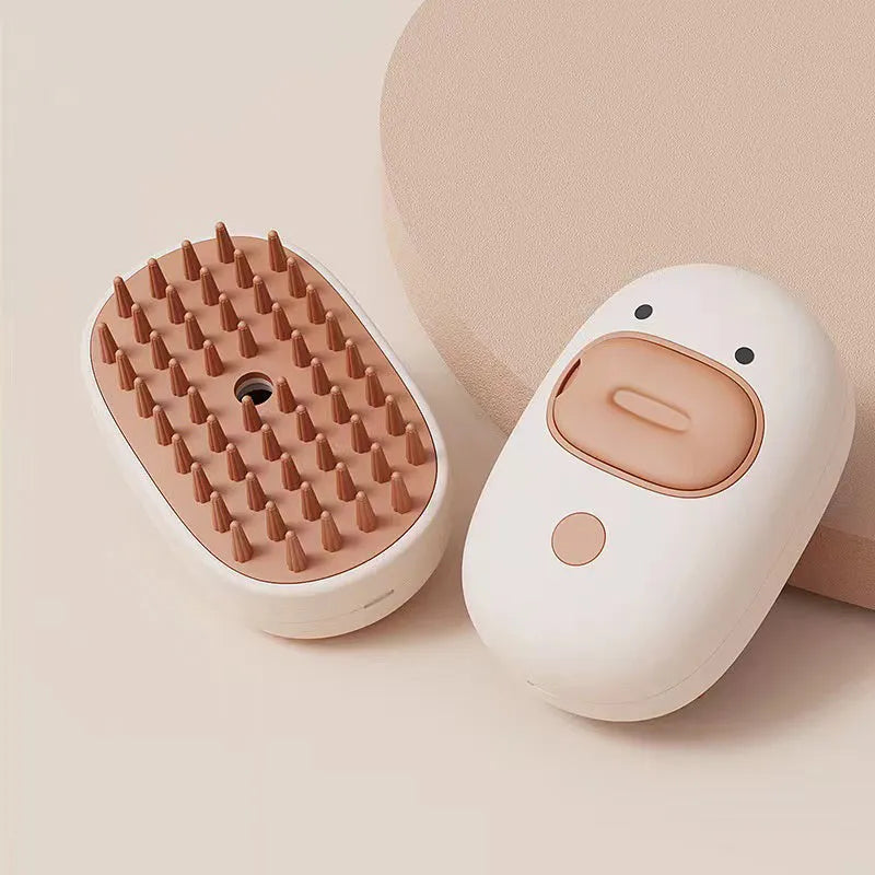 White and yellow electric pet steam brush with rubber comb teeth and ergonomic handle