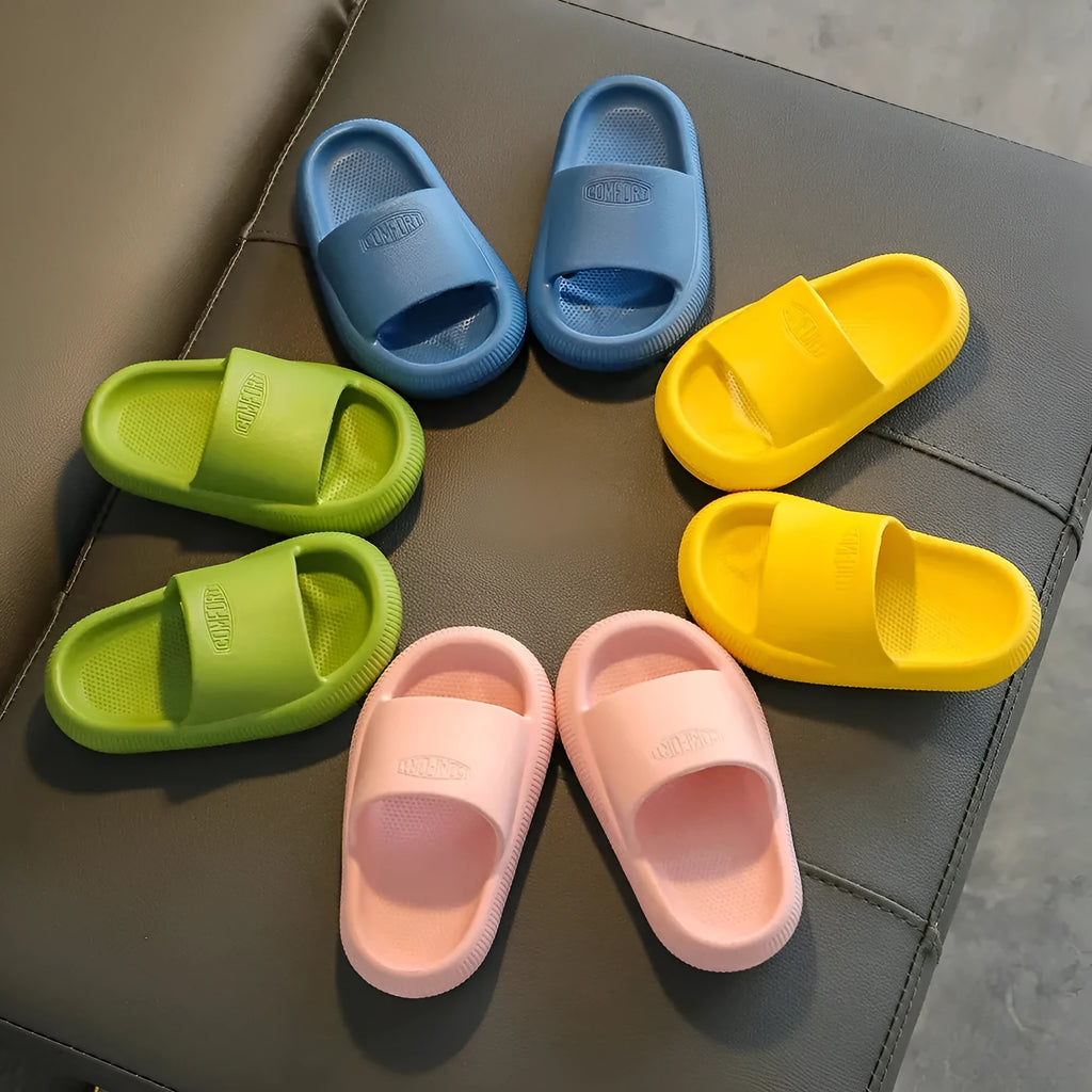Children's EVA slippers in mixed colours with non-slip soles showing size range 24-35