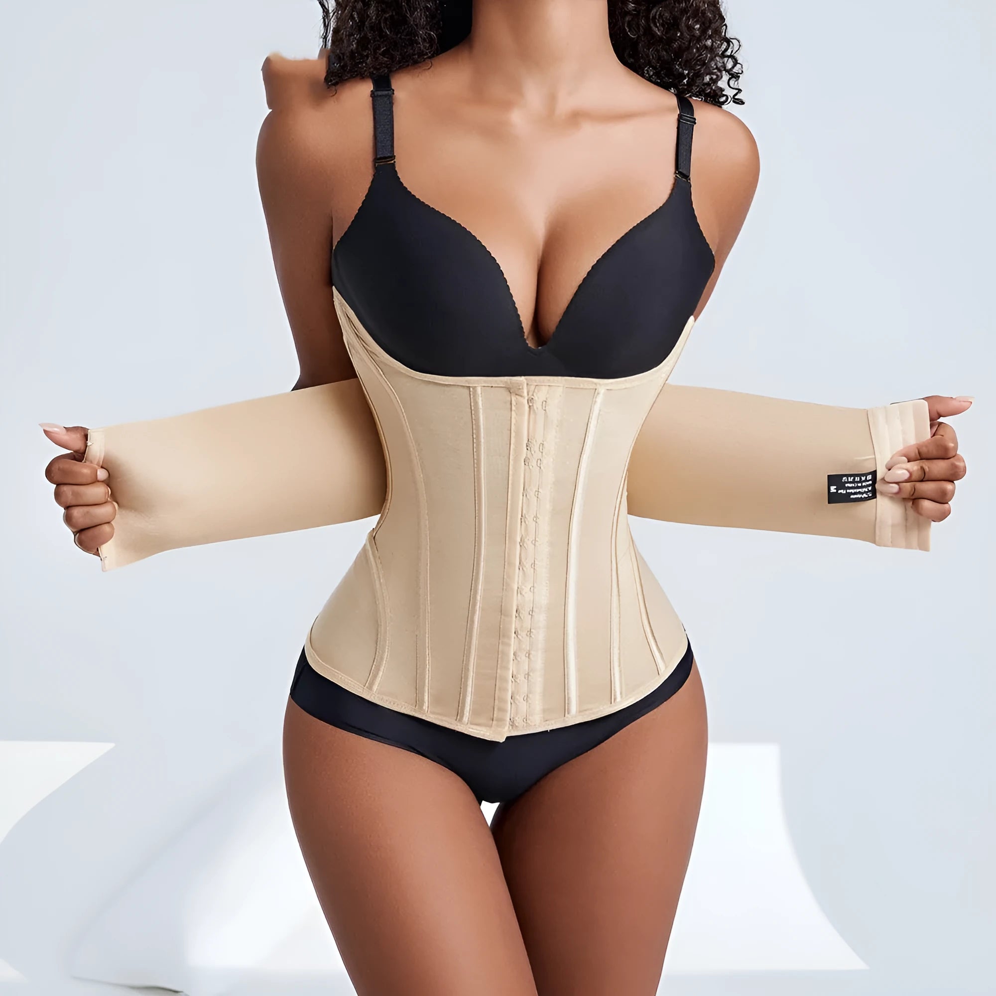 Nylon belly band waist trainer in black or apricot colour with belt tie adjustment