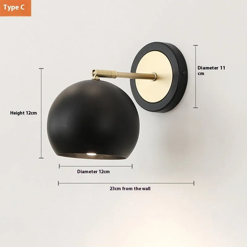 Nordic style iron table lamp with metal shade on a wooden bedside table