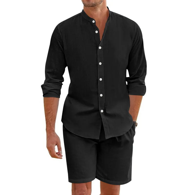 Man wearing a dark grey linen blend short sleeve shirt and matching drawstring shorts summer suit.