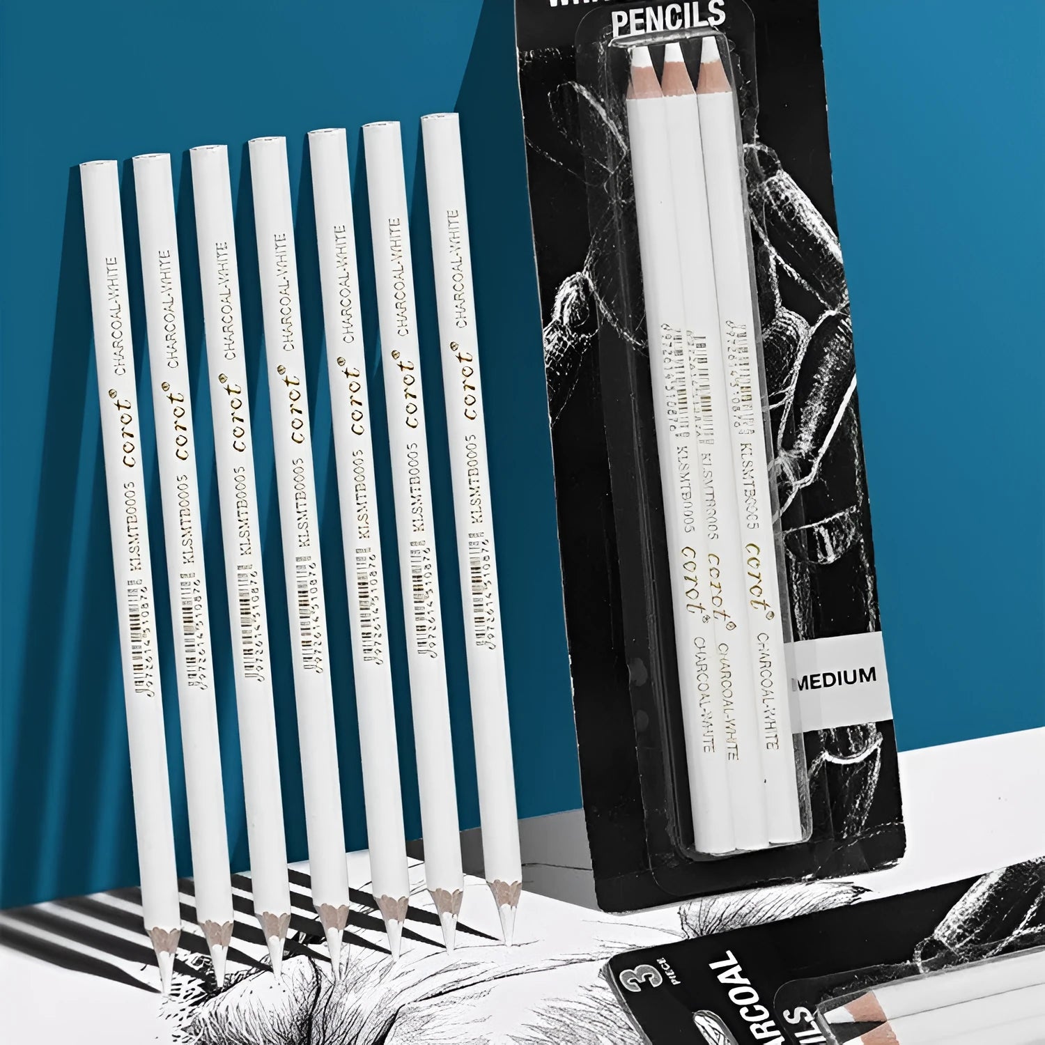 Three white charcoal highlighting pencils in wooden barrels for sketching and drawing