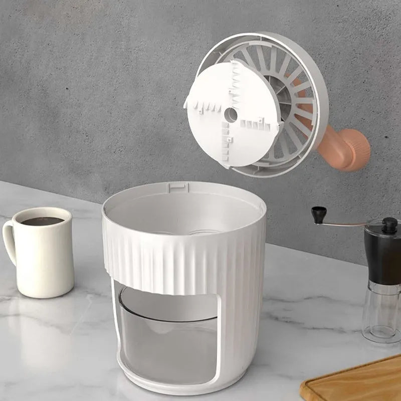 Hand-cranked ice shaving machine in green with removable ice box and ergonomic handle