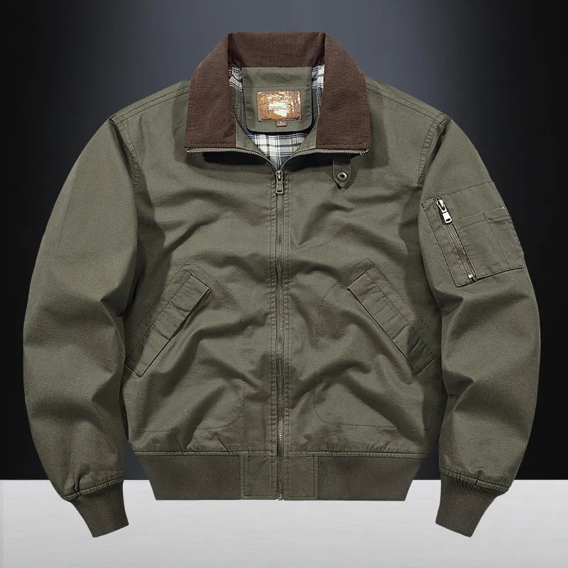 Men's beige washed cotton flight jacket on a hanger, showing its simple design and cotton fabric texture.