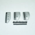 Aluminium alloy manual transmission car pedal set in grey or black with brake, accelerator, and clutch pedals.