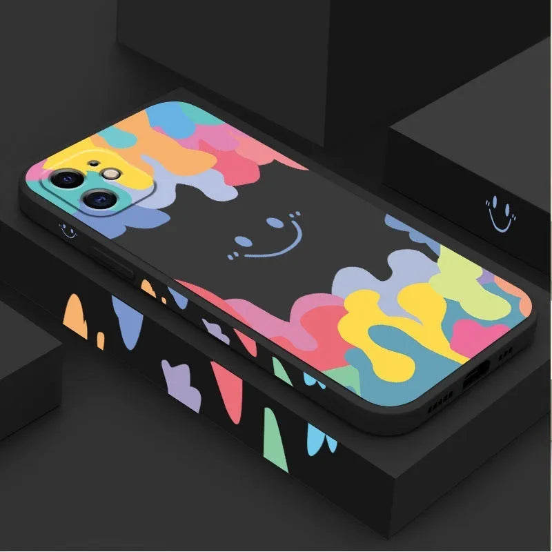 Rainbow smiley face design on white or black camouflage TPU iPhone case with attached carrying lanyard