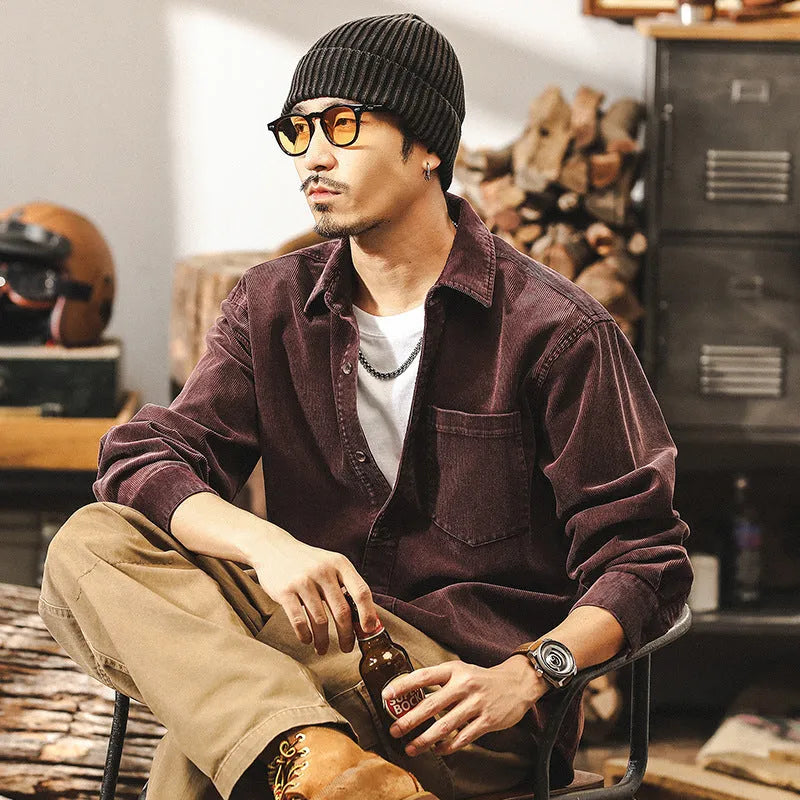 Men's loose-fit retro corduroy shirt jacket in red or black, showing long sleeves and textured fabric.
