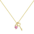 925 sterling silver heart-shaped key pendant necklace in gold finish on display