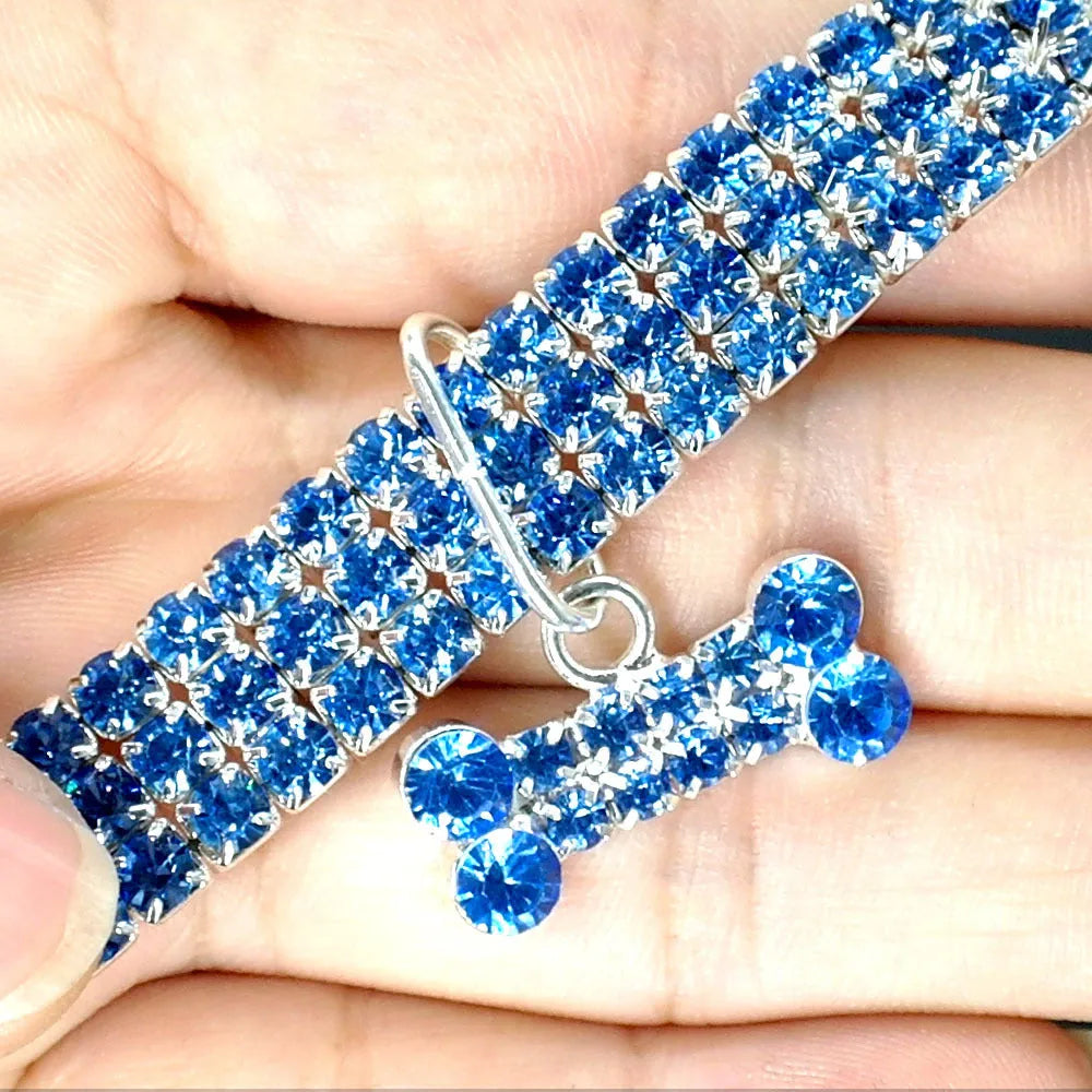 Bling rhinestone dog collar with crystal pendant on a small dog, blue colour, adjustable size S