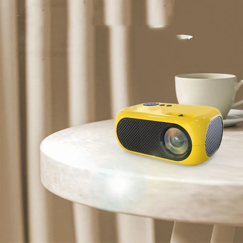M24 portable mini projector in gold colour showing compact dimensions and included accessories