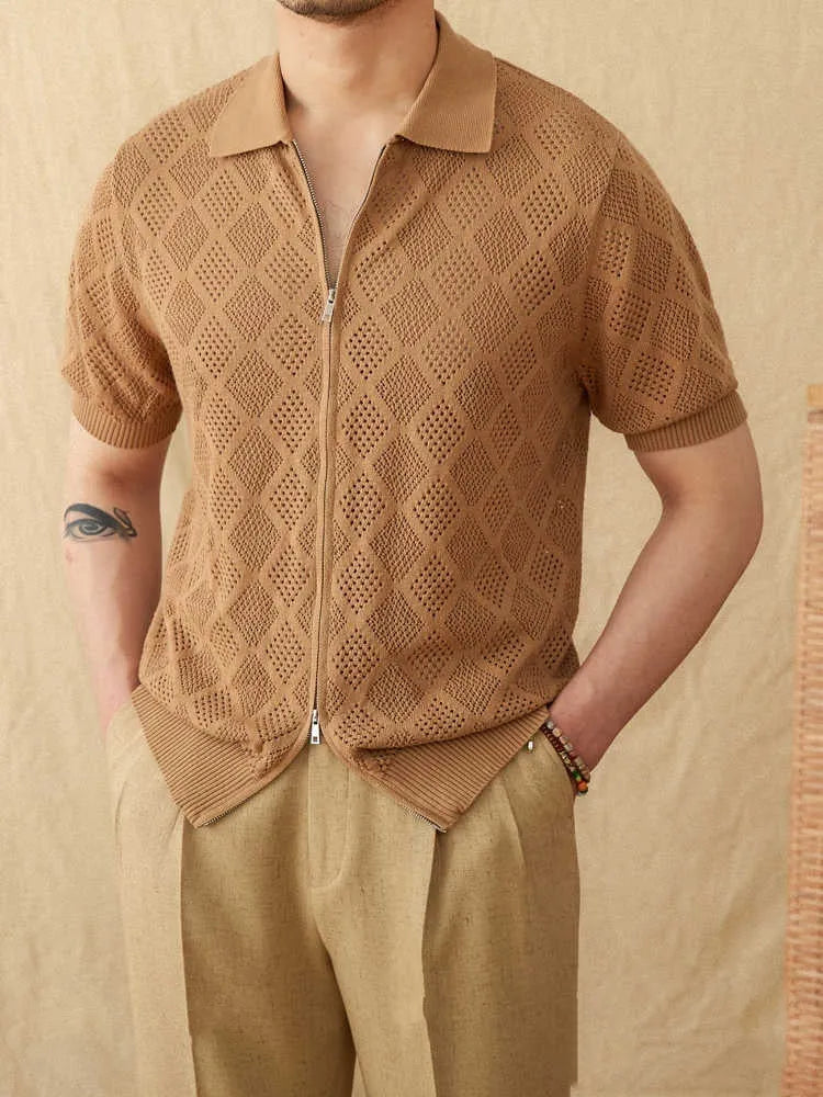 Men's light brown short sleeve cotton cardigan with zip front and lapel collar laid flat.