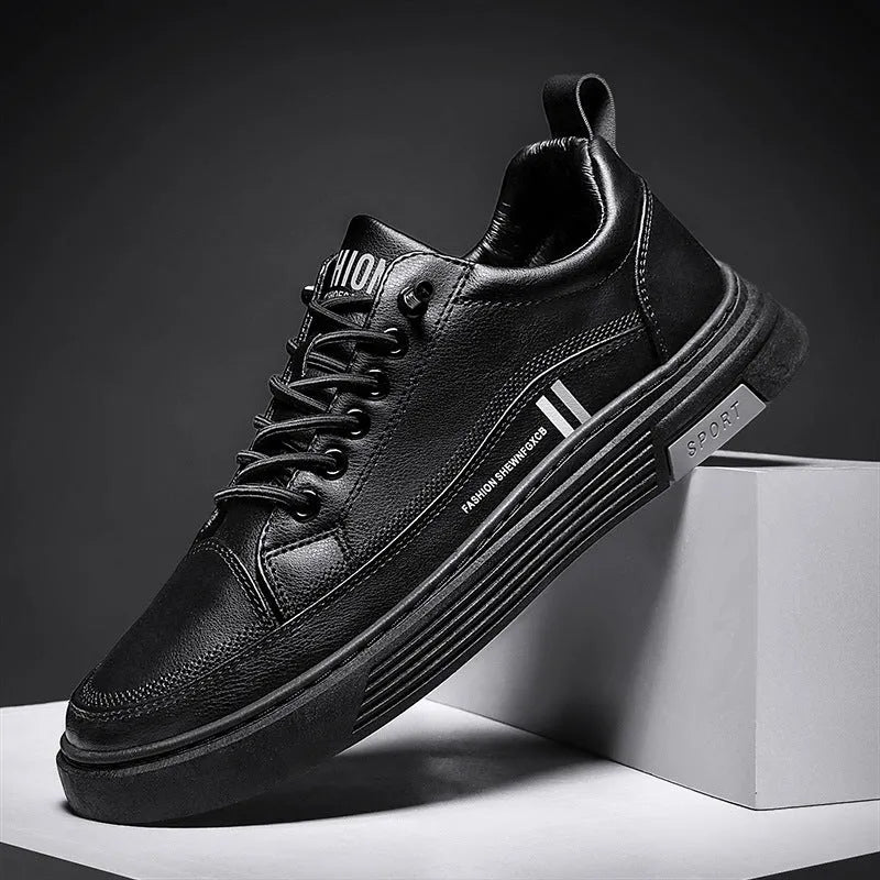Men's low-top skate shoes in black with microfiber upper, rubber sole, and elastic band.