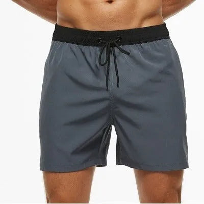 Men's blue training shorts with stitching waist detail and headband pocket